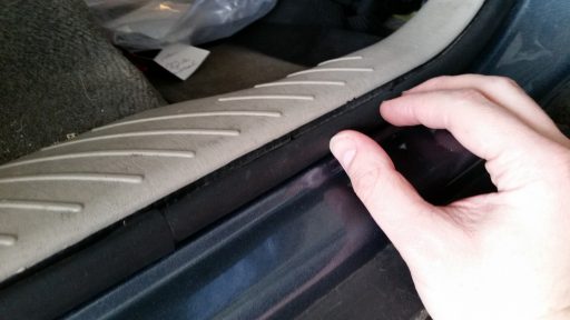 Holding Car Door Weatherstripping in Place to Set